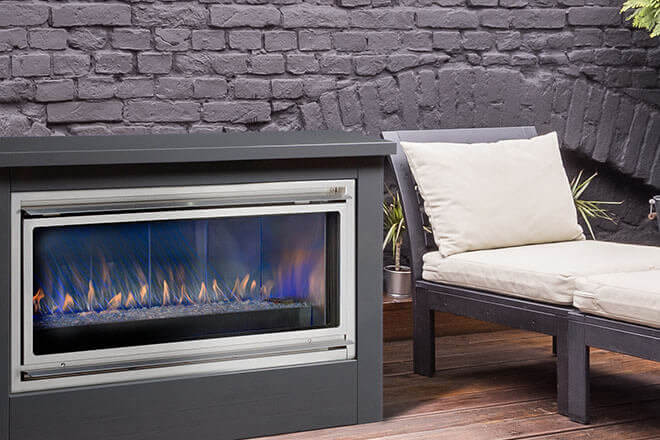 Montigo Ventless Outdoor Mahana Fireplace, shown with Graphite enclosure