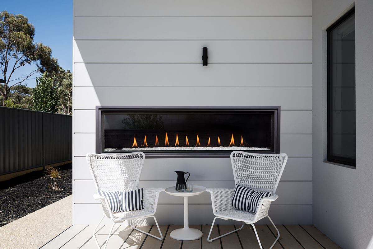 White shiplap fireplace wall